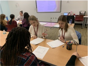 Photo of Academic Trainers assisting students