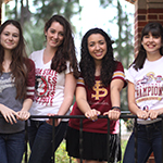 Photo of FSU students standing under arch on campus